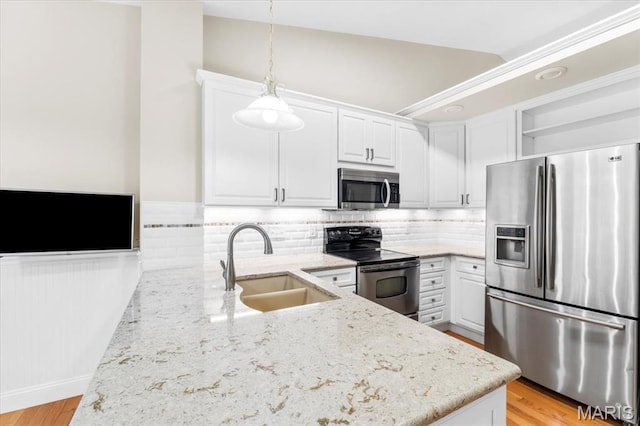 1136 Arbor Place Dr, Manchester, MO 63088 - kitchen with stainless steel appliances, light stone counters, white cabinetry, open shelves, and backsplash