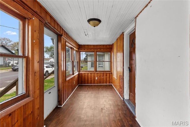 120 E 1st St, Hartford, IL 62048 - unfurnished sunroom with wood finished floors, baseboards, and wood walls