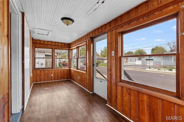 120 E 1st St, Hartford, IL 62048 - unfurnished sunroom featuring wood finished floors and wood walls