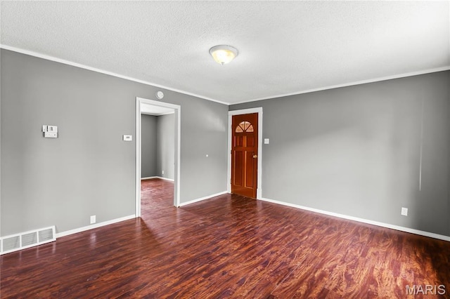 120 E 1st St, Hartford, IL 62048 - unfurnished room with wood finished floors, crown molding, a textured ceiling, and baseboards