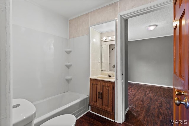 120 E 1st St, Hartford, IL 62048 - full bathroom featuring toilet, wood finished floors, vanity, and shower / bath combination