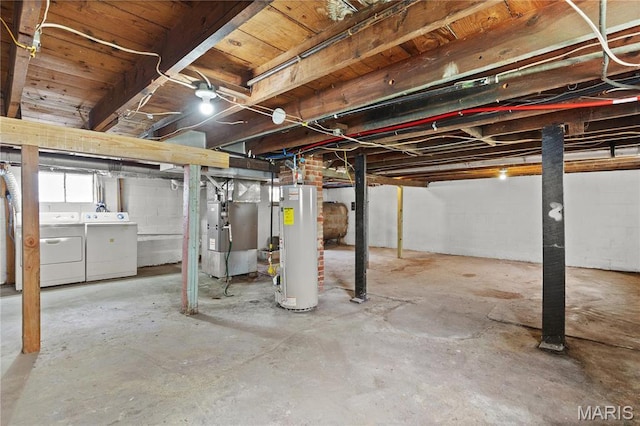 120 E 1st St, Hartford, IL 62048 - below grade area featuring water heater, washer and dryer, oil tank, and heating unit