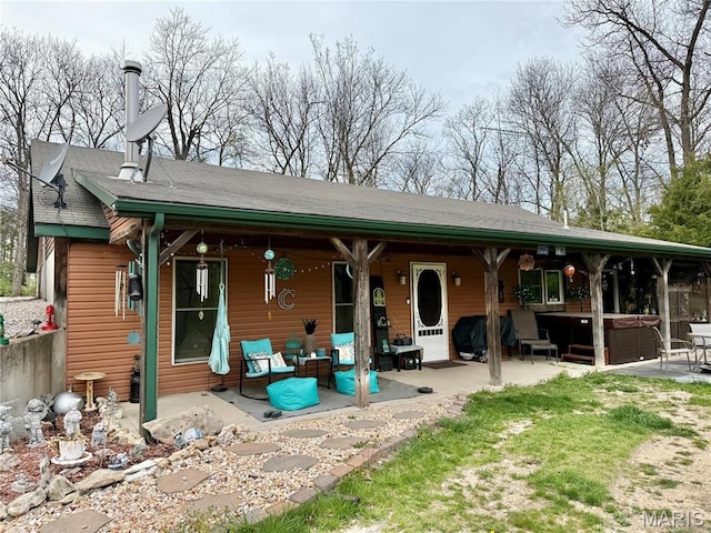 42 Berger Rd, Middletown, MO 63359 - back of house featuring a hot tub and a patio area