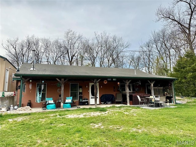 42 Berger Rd, Middletown, MO 63359 - back of property with a patio area and a lawn