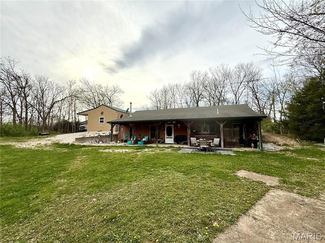 42 Berger Rd, Middletown, MO 63359 - rear view of house with a patio area and a lawn
