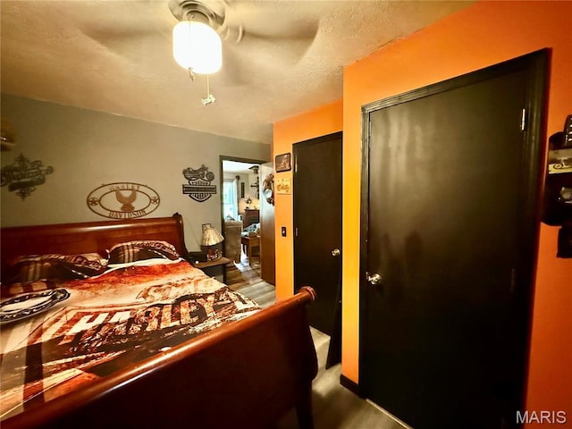 42 Berger Rd, Middletown, MO 63359 - bedroom with a ceiling fan and wood finished floors