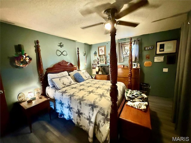 42 Berger Rd, Middletown, MO 63359 - bedroom featuring a textured ceiling, wood finished floors, and ceiling fan