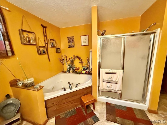 42 Berger Rd, Middletown, MO 63359 - bathroom featuring a stall shower, a tub with jets, and a textured ceiling