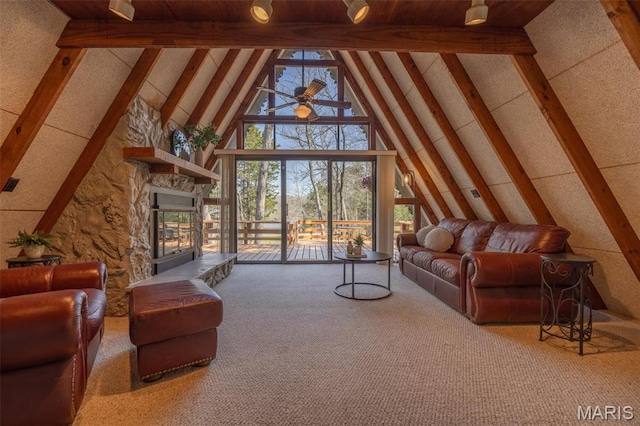 living room with beam ceiling, high vaulted ceiling, a ceiling fan, carpet flooring, and a stone fireplace