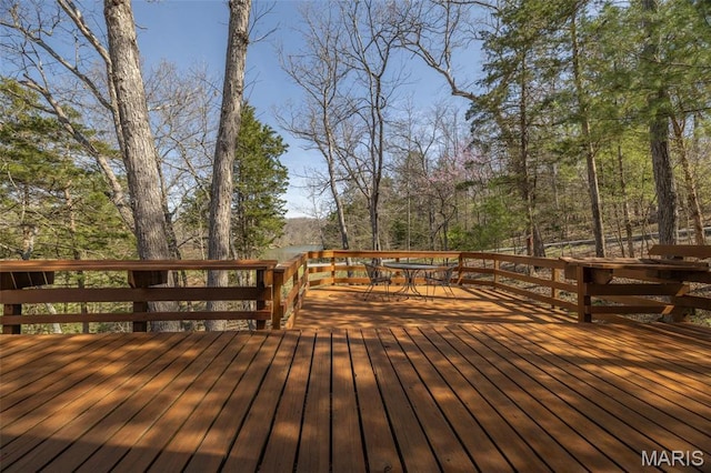 wooden deck with outdoor dining area
