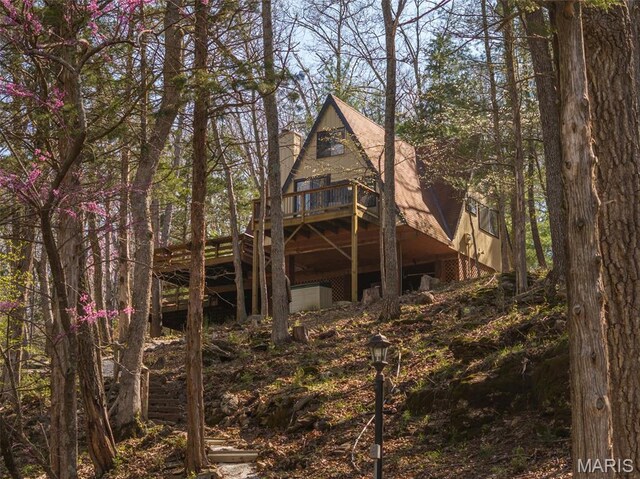 rear view of house with a deck