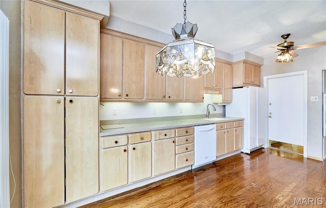 10359 Corbeil Dr Unit D, Saint Louis, MO 63146 - kitchen featuring white appliances, light brown cabinetry, light countertops, a ceiling fan, and a sink