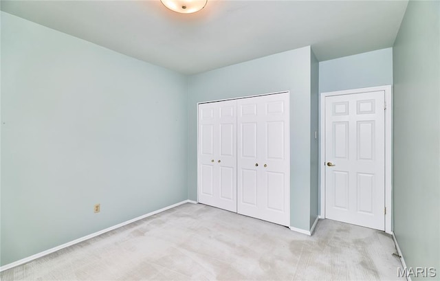 10359 Corbeil Dr Unit D, Saint Louis, MO 63146 - unfurnished bedroom with carpet flooring, baseboards, and a closet