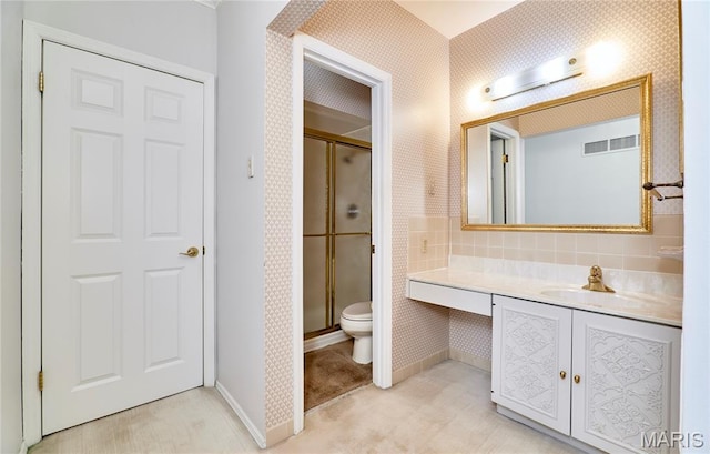 10359 Corbeil Dr Unit D, Saint Louis, MO 63146 - full bath featuring a stall shower, toilet, vanity, wallpapered walls, and baseboards