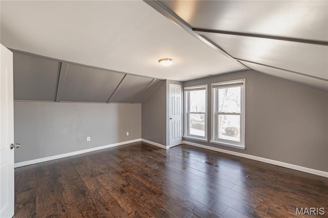 7122 Drury Ln, Saint Louis, MO 63143 - additional living space featuring vaulted ceiling, baseboards, and wood finished floors