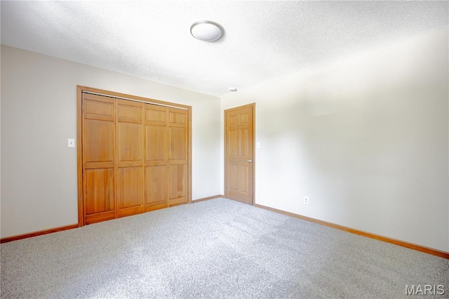 6 Mapleleaf Ln, Belleville, IL 62223 - unfurnished bedroom featuring baseboards, carpet floors, a closet, and a textured ceiling