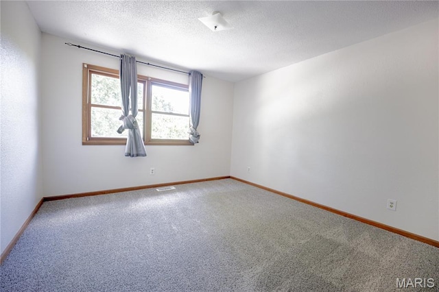 6 Mapleleaf Ln, Belleville, IL 62223 - carpeted empty room featuring baseboards and a textured ceiling