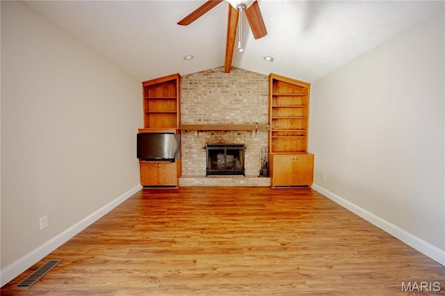 6 Mapleleaf Ln, Belleville, IL 62223 - unfurnished living room with ceiling fan, baseboards, a fireplace, and light wood-style floors