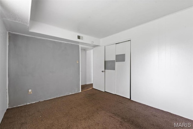 2797 Dawnview Dr, Florissant, MO 63031 - unfurnished bedroom featuring dark colored carpet and a closet