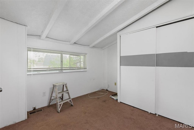2797 Dawnview Dr, Florissant, MO 63031 - unfurnished bedroom with carpet floors, a textured ceiling, and a closet