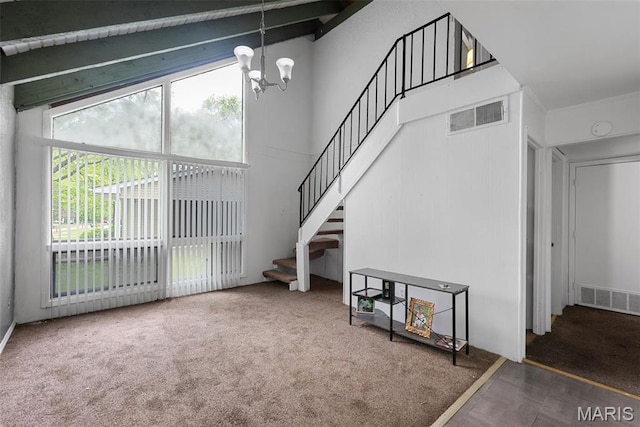 2797 Dawnview Dr, Florissant, MO 63031 - carpeted living area with healthy amount of natural light, a chandelier, and stairs