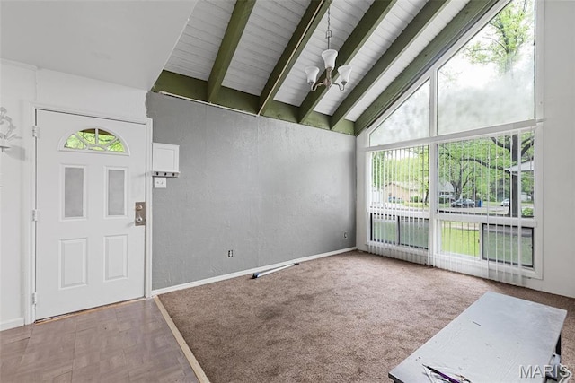 2797 Dawnview Dr, Florissant, MO 63031 - entrance foyer featuring plenty of natural light, beam ceiling, high vaulted ceiling, baseboards, and wooden ceiling