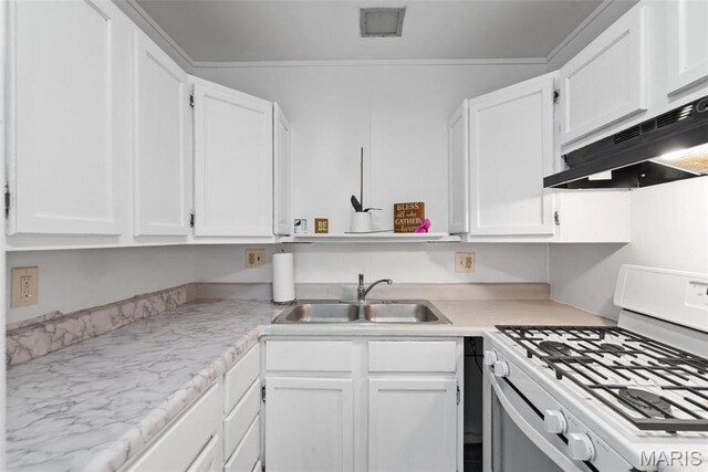 2797 Dawnview Dr, Florissant, MO 63031 - kitchen with white gas stove, under cabinet range hood, a sink, white cabinets, and light countertops