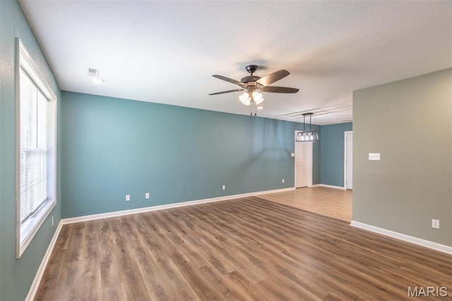 1501 Vincent St, Poplar Bluff, MO 63901 - spare room with ceiling fan, wood finished floors, and baseboards