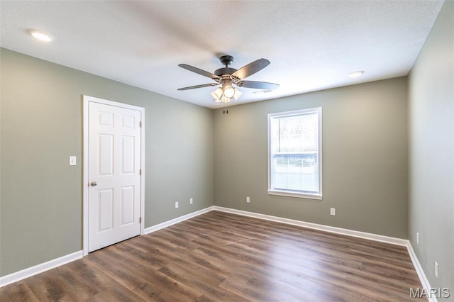 1501 Vincent St, Poplar Bluff, MO 63901 - empty room featuring a ceiling fan, wood finished floors, and baseboards