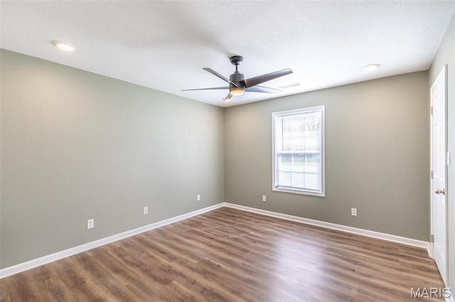 1501 Vincent St, Poplar Bluff, MO 63901 - spare room with wood finished floors, ceiling fan, baseboards, a textured ceiling, and recessed lighting