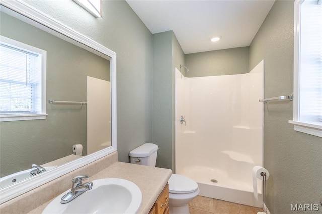 1501 Vincent St, Poplar Bluff, MO 63901 - full bath featuring a shower, vanity, toilet, tile patterned flooring, and plenty of natural light