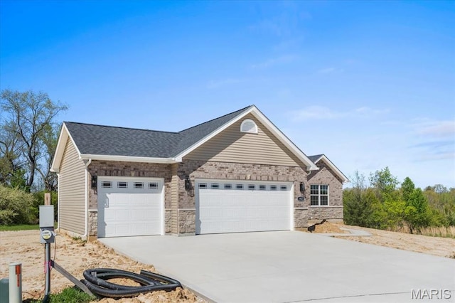 1423 Wild Ridge Estates Ct, Florissant, MO 63033 - view of front of house featuring a garage, driveway, and roof with shingles