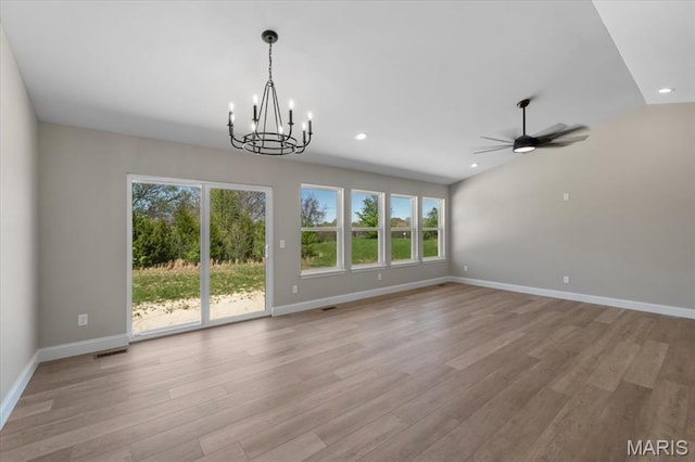 1423 Wild Ridge Estates Ct, Florissant, MO 63033 - unfurnished living room with plenty of natural light, baseboards, a chandelier, wood finished floors, and recessed lighting