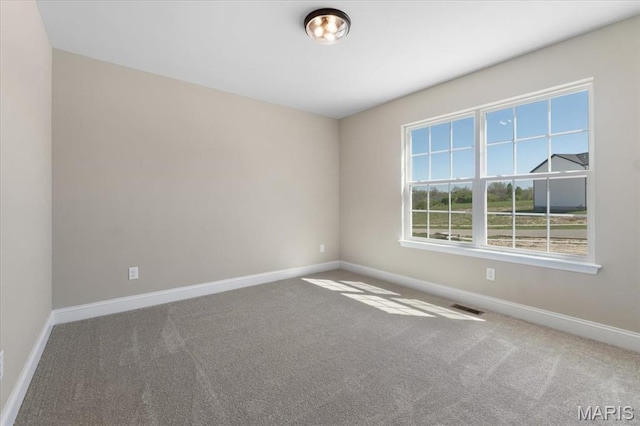 1423 Wild Ridge Estates Ct, Florissant, MO 63033 - carpeted empty room featuring baseboards