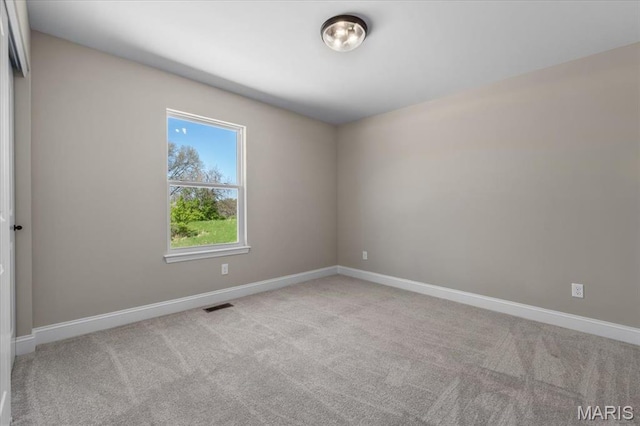 1423 Wild Ridge Estates Ct, Florissant, MO 63033 - carpeted spare room featuring baseboards