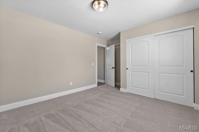 1423 Wild Ridge Estates Ct, Florissant, MO 63033 - unfurnished bedroom with carpet floors, baseboards, and a closet