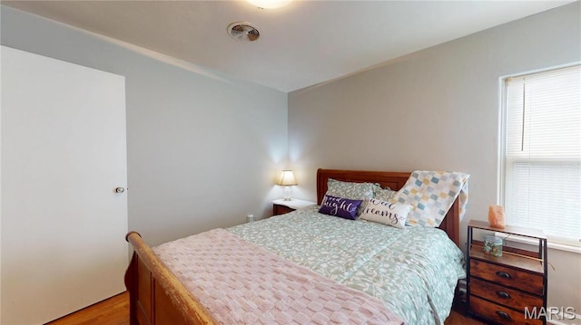 bedroom with wood finished floors