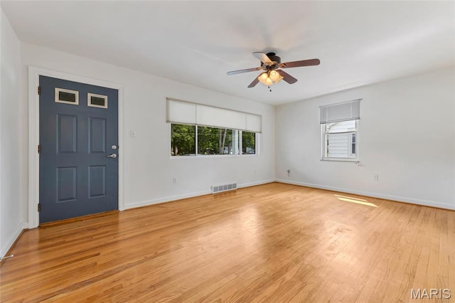 509 N Jefferson St, Mascoutah, IL 62258 - entryway featuring a ceiling fan, light wood finished floors, and baseboards