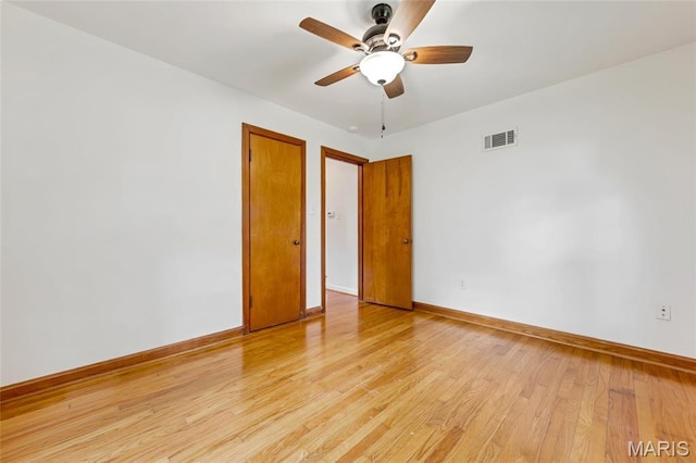 509 N Jefferson St, Mascoutah, IL 62258 - spare room with baseboards, a ceiling fan, and light wood finished floors