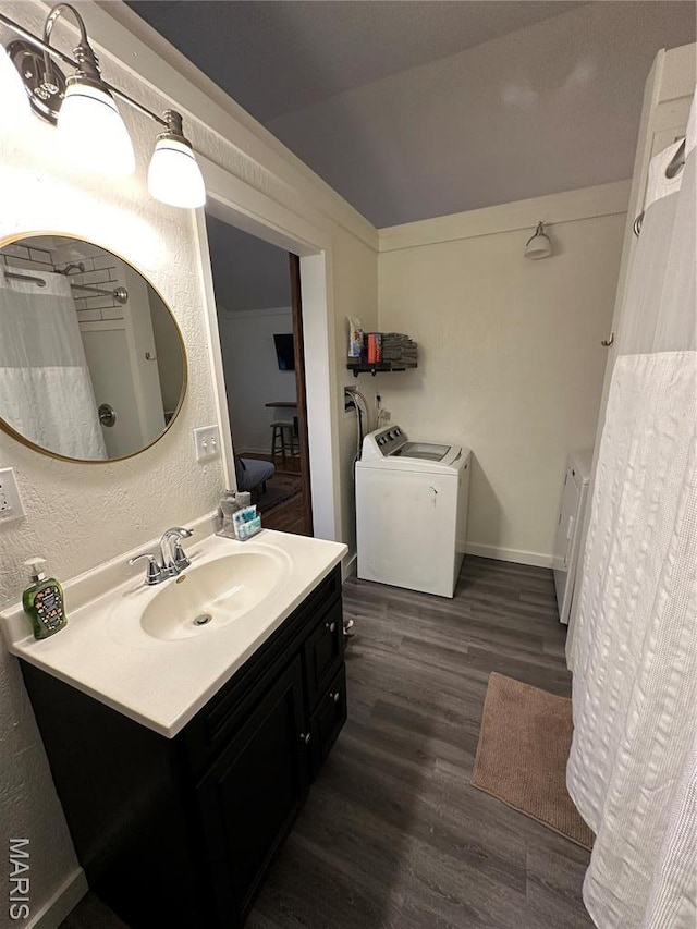 509 N Jefferson St, Mascoutah, IL 62258 - full bath featuring washing machine and dryer, wood finished floors, and vanity