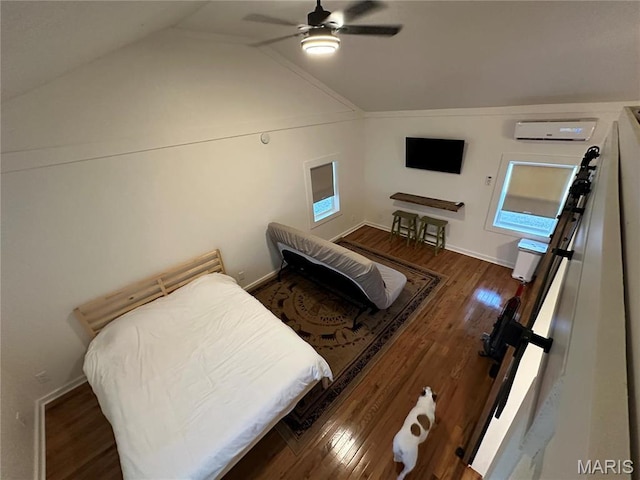 509 N Jefferson St, Mascoutah, IL 62258 - bedroom featuring a wall mounted AC, lofted ceiling, wood finished floors, a ceiling fan, and baseboards