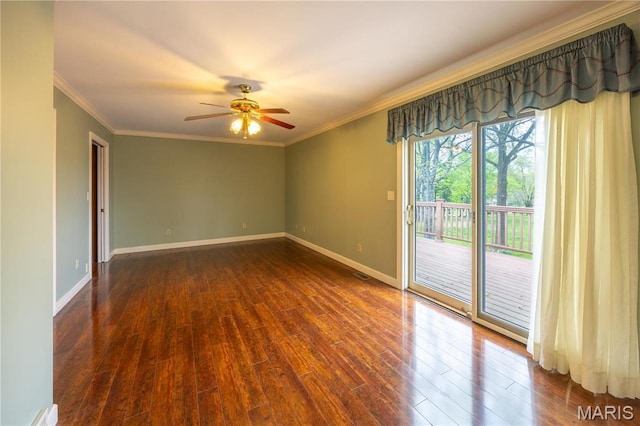 unfurnished room with ceiling fan, wood finished floors, ornamental molding, and baseboards