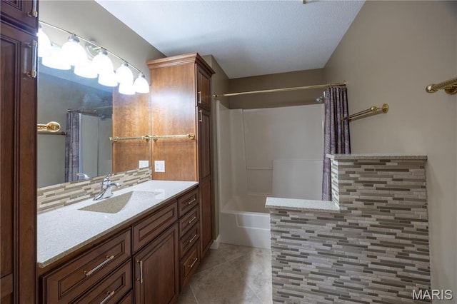 bathroom with tile patterned flooring, vanity, and shower / tub combo with curtain