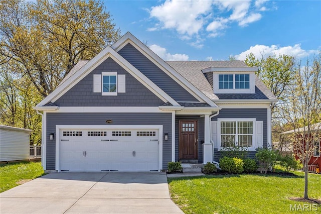 11910 Lillian Ave, Saint Louis, MO 63131 - view of front of home featuring driveway, a front yard, an attached garage, and roof with shingles