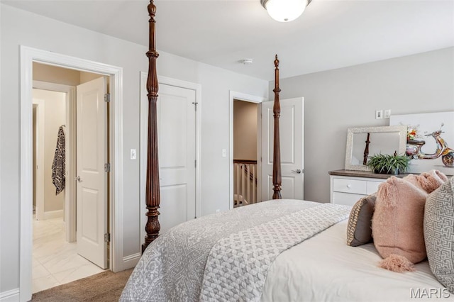 11910 Lillian Ave, Saint Louis, MO 63131 - bedroom with light marble finish floors and ensuite bathroom