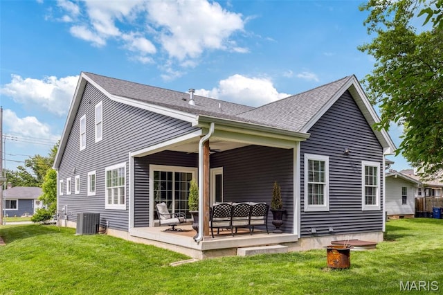 11910 Lillian Ave, Saint Louis, MO 63131 - back of house featuring central AC, a lawn, a patio, and roof with shingles