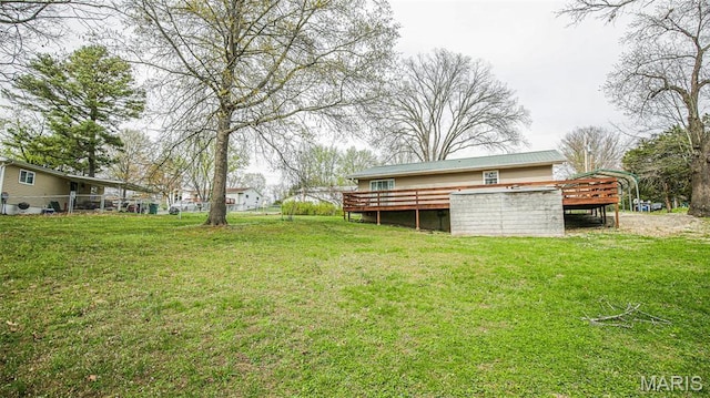 14153 Spring Dr, De Soto, MO 63020 - view of green lawn with a deck and a carport