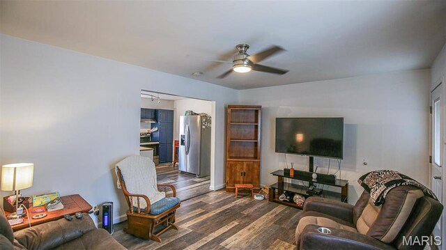 14153 Spring Dr, De Soto, MO 63020 - living room with dark wood-type flooring, a ceiling fan, and baseboards