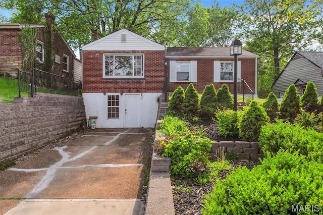 831 Diversey Dr, Saint Louis, MO 63126 - view of front of house with brick siding and fence