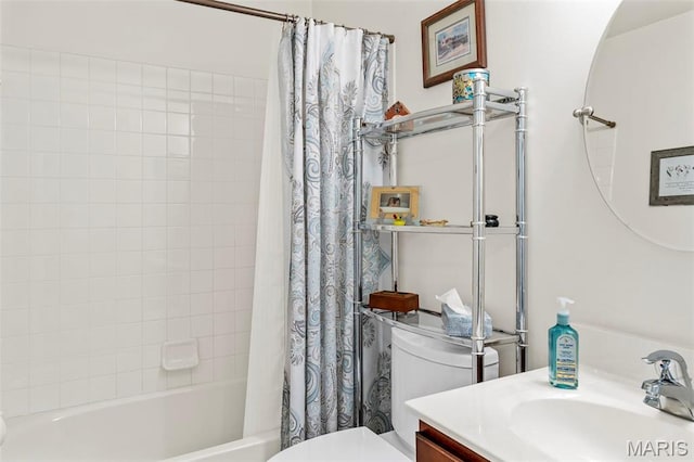 bathroom with toilet, shower / bath combination with curtain, and vanity